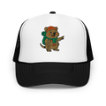 Quokka Adventure Hat front view - Black and white foam trucker hat with embroidered Scout quokka character wearing red beanie and hiking backpack